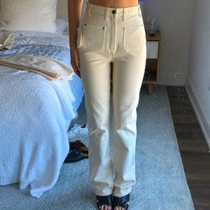 High Waisted Cream Jeans. Pocket accents on the front